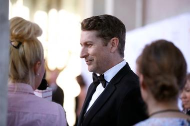 Host Scott Aukerman talks to the press at the 67th Los Angeles Area Emmy Awards July 25, 2015, at the Skirball Cultural Center in Los Angeles, California.