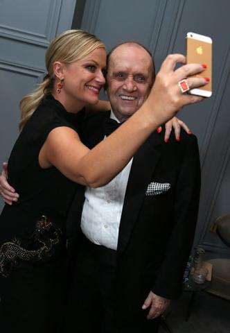 Amy Poehler takes a selfie with Bob Newhart in the Audi Green Room at the 65th Emmy Awards.