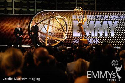 Norman Brokaw accepts the Governors Award from John Shaffner onstage during the 62nd Primetime Creative Arts Emmy Awards