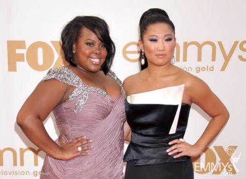 (L-R) Amber Riley and Jenna Ushkowitz arrives at the Academy of Television Arts & Sciences 63rd Primetime Emmy Awards
