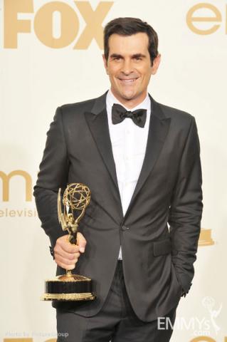 Ty Burrell poses with the award for "Oustanding Supporting Actor in a Comedy Series" in the press room