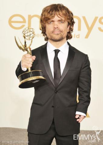 Peter Dinklage poses with the award for "Outstanding Supporting Actor in a Drama Series" in the press room