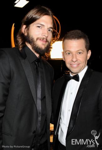 Ashton Kutcher (L) and Jon Cryer backstage during the Academy of Television Arts & Sciences 63rd Primetime Emmy Awards