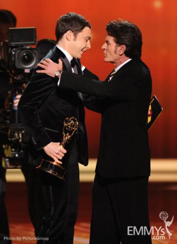 (L-R) Jim Parsons accepts the award for "Outstanding Lead Actor in a Comedy Series" from Charlie Sheen