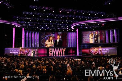Stana Katic (L) and Andrew W. Marlowe speak onstage during the 62nd Primetime Creative Arts Emmy Awards