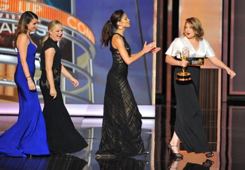 Tina Fey, Amy Poehler, and Merritt Wever on stage at the 65th Emmys