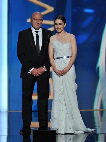 Dean Norris and Emilia Clarke on stage at the 65th Emmys