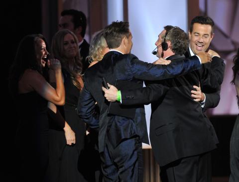 Carson Daly and Mark Burnett on stage at the 65th Emmys