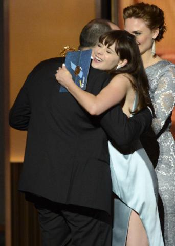 Emily Deschanel and Zooey Deschanel present Tony Hale with the award for Outstanding Supporting Actor in a Comedy 