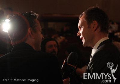 Noms ceremony host, actor Joel McHale speaks with a reporter at Goldenson Theatre.