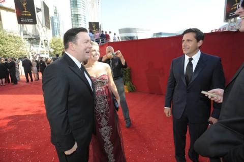 Ricky Gervais, with guest Jane Fallon, greets Steve Carell at the 60th Primetime Emmy Awards 