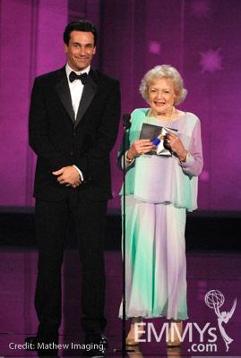 Actors Jon Hamm (L) and Betty White present an award onstage at the 62nd Annual Primetime Emmy Awards held at the Nokia Theatre
