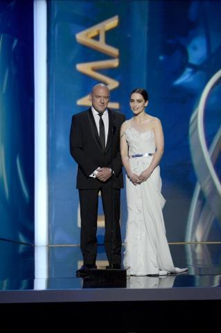 Dean Norris and Emilia Clarke on stage at the 65th Emmys