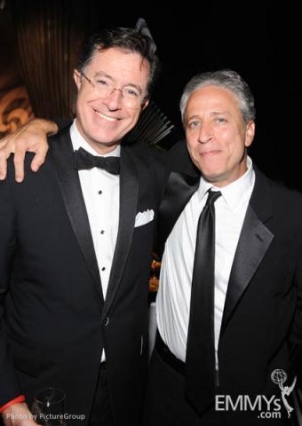 Stephen Colbert (L) and Jon Stewart at the Governors Ball during the Academy of Television Arts & Sciences 63rd Primetime Emmys