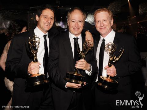 (L-R) Co-Executive Producers for "Modern Family" Bill Wrubel, Danny Zuker and Jeff Morton pose with their awards.