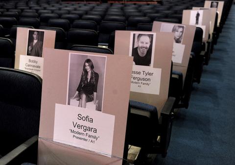 A modern family sitting together for the 65th Emmy Awards.