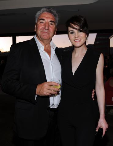 Jim Carter (l) and Michelle Dockery (r) of Downton Abbey attend the 2014 Primetime Emmys.
