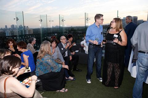 Peer group members and guests enjoy the picturesque rooftop setting at the London Hotel in West Hollywood, California.