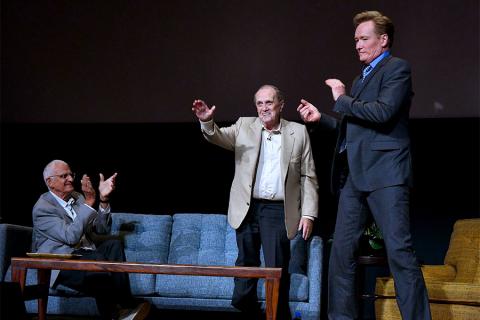 Bob Newhart says goodnight to his audience while Peter Bonerz and Conan O'Brien look on at The Rise of the Cerebral Comedy: A Conversation with Bob Newhart, presented Tuesday, Aug. 8, 2017, at the Television Academy's Wolf Theater at the Saban Media Cente