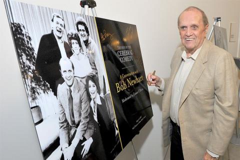 Bob Newhart signs a show poster at The Rise of the Cerebral Comedy: A Conversation with Bob Newhart, presented Tuesday, Aug. 8, 2017, at the Television Academy's Wolf Theater at the Saban Media Center in North Hollywood, California. 