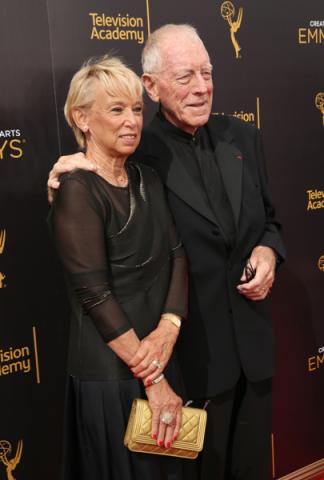 Catherine Brelet and Max von Sydow on the red carpet at the 2016 Creative Arts Emmys.