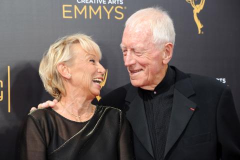 Catherine Brelet and Max von Sydow arrive on the red carpet at the 2016 Creative Arts Emmys.