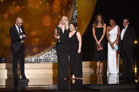The Game of Thrones makeup team accept an award at the 2016 Creative Arts Emmys. 