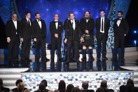 The team from Game of Thrones accepts their award at the 2016 Creative Arts Emmys. 