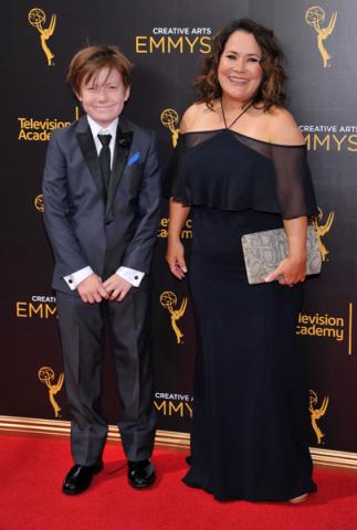 Carolyn Omine and guest on the red carpet at the 2016 Creative Arts Emmys.