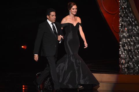 Oscar Nunez and Erinn Hayes on stage at the 2016 Creative Arts Emmys.