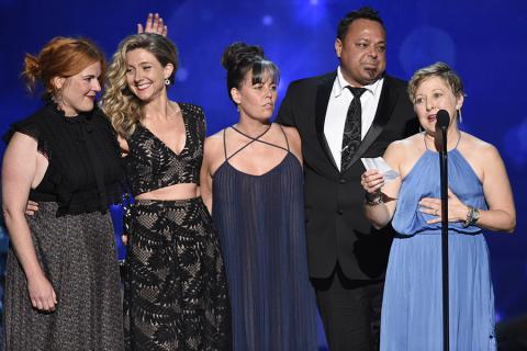 The hairstyling team from Saturday Night Live accepts an award at the 2016 Creative Arts Emmys.