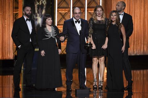The Saturday Night Live team accepts an award at the 2017 Creative Arts Emmys. 