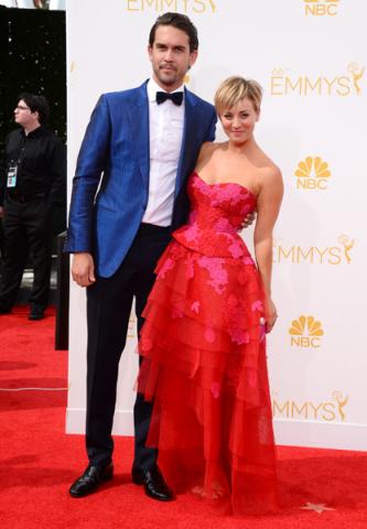 Ryan Sweeting and Kaley Cuoco-Sweeting of The Big Bang Theory arrive at the 66th Emmys. 