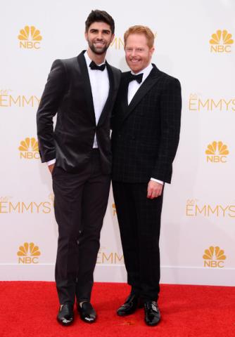 Jesse Tyler Ferguson of Modern Family and his husband Justin Mikita arrive at the 66th Emmy Awards.