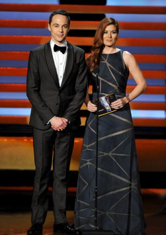 Jim Parsons (l) of The Big Bang Theory and Debra Messing present an award at the 66th Emmy Awards.