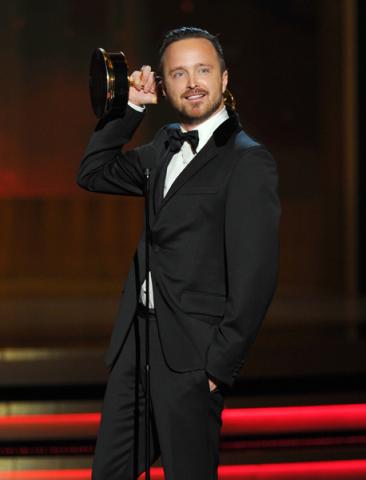 Aaron Paul of Breaking Bad accepts an award at the 66th Emmys.