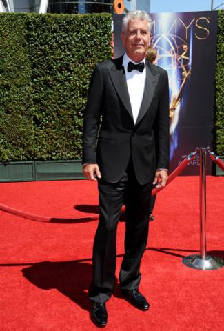 Anthony Bourdain arrives for the 2014 Primetime Creative Arts Emmys.