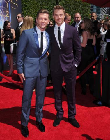 Travis Wall of So You Think You Can Dance and Derek Hough of Dancing with the Stars arrive for the 2014 Primetime Creative Arts Emmys.