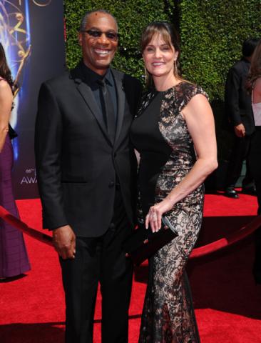 Joe Morton of Scandal and wife Nora Chavooshian arrives for the 2014 Primetime Creative Arts Emmys.