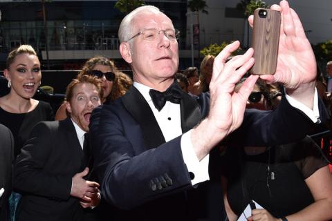 Tim Gunn of Project Runway arrives for the 2014 Primetime Creative Arts Emmys.