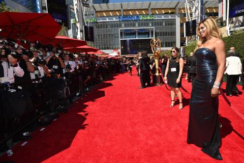 Laverne Cox of Orange Is the New Black arrives for the 2014 Primetime Creative Arts Emmys.