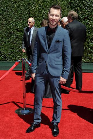 Christopher Scott arrives for the 2014 Primetime Creative Arts Emmys.