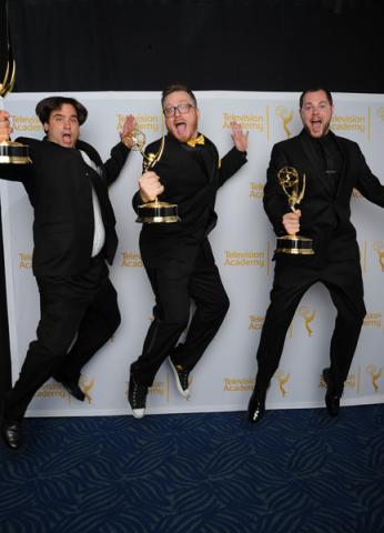 Deadliest Catch editors Rob Butler (l), Josh Earl (c) and Art O'Leary (r) celebrate their win at the 2014 Primetime Creative Arts Emmys.