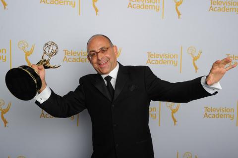 Peter Chakos celebrates at the 2014 Primetime Creative Arts Emmys.
