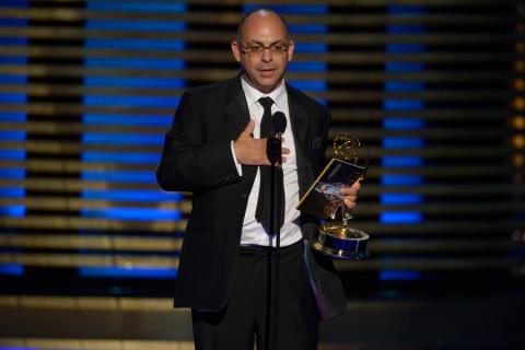 Editor Peter Chakos of The Big Bang Theory accepts an award at the 2014 Primetime Creative Arts Emmys.