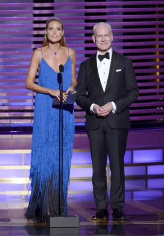 Heidi Klum and Tim Gunn present an award at the 2014 Primetime Creative Arts Emmys.