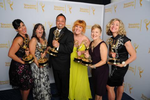 The Saturday Night Live hairstyling team celebrate their win at the 2014 Primetime Creative Arts Emmys.