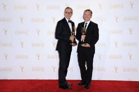 Saturday Night Live costume designers Tom Broecker (l) and Eric Justian (r) celebrate their win at the 2014 Primetime Creative Arts Emmys.
