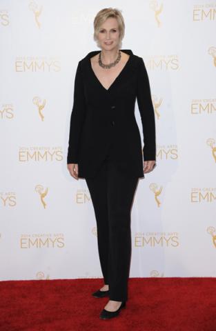 Jane Lynch celebrates her win for Hollywood Game Night at the 2014 Primetime Creative Arts Emmys.
