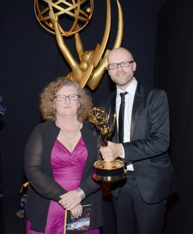 Game of Thrones makeup artist Jane Walker (l) and prosthetic designer Barrie Gower (r) celebrate their win at the 2014 Primetime Creative Arts Emmys.